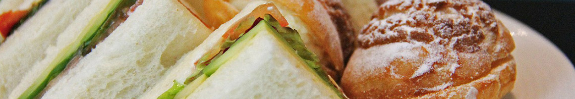 Eating Deli Middle Eastern Sandwich at Little Market restaurant in Hoboken, NJ.